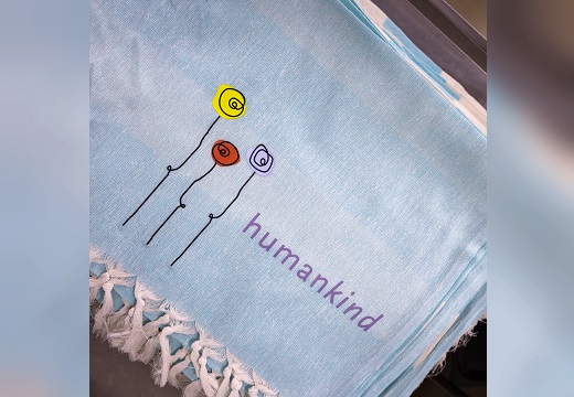 hamamdoek met humankind logo erop
